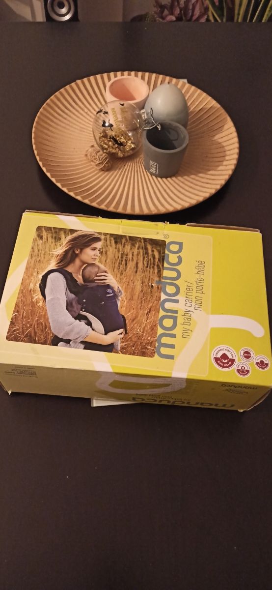 Manduca. mochila portabebes.