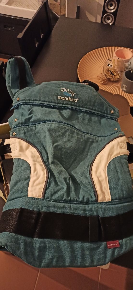 Manduca. mochila portabebes.