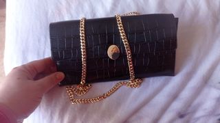 Cartera de mano negra de segunda mano por 9 EUR en Adra en WALLAPOP