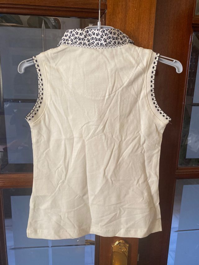Camiseta niña sin mangas talla 7 añis con etiqueta