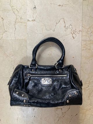 Bolso de charol Tous de segunda mano por 15 EUR en Málaga en WALLAPOP