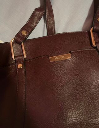 Bolso granate Misako de segunda mano por 15 EUR en Ortuella en WALLAPOP