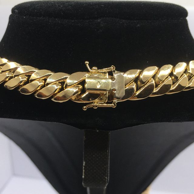 CADENA CARTIER CUBANA VERSACE ORO 18K de segunda mano por 3.240 EUR en Alicante en WALLAPOP