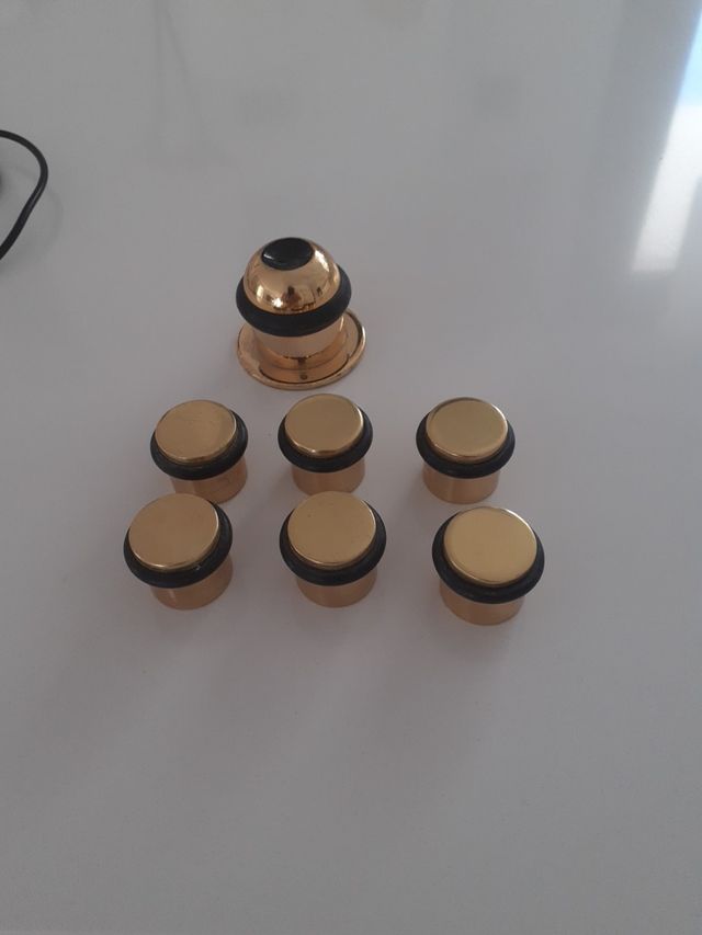 12 topes puertas nuevos  dorados .pequeños y grand