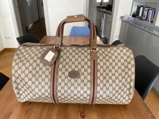 Maleta de viaje Gucci de segunda mano por 120 EUR en Barcelona en WALLAPOP