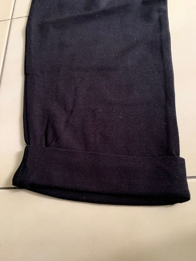 Tuta lunga nera con dettagli in pizzo