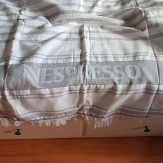 Toalla de playa Nespresso Preciosa toalla de playa de segunda mano por 10  EUR en Galapagar en WALLAPOP