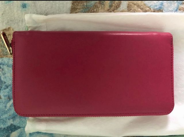 Cartera tous fucsia nueva. Precio negociable.