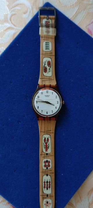Reloj Swatch motivo platos del mar de segunda mano por 20 EUR en Barcelona  en WALLAPOP
