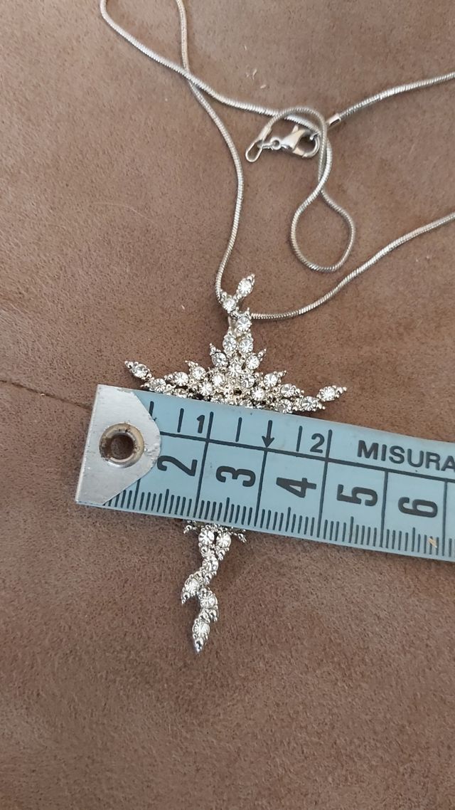 alta bigiotteria croce con pietre bianche