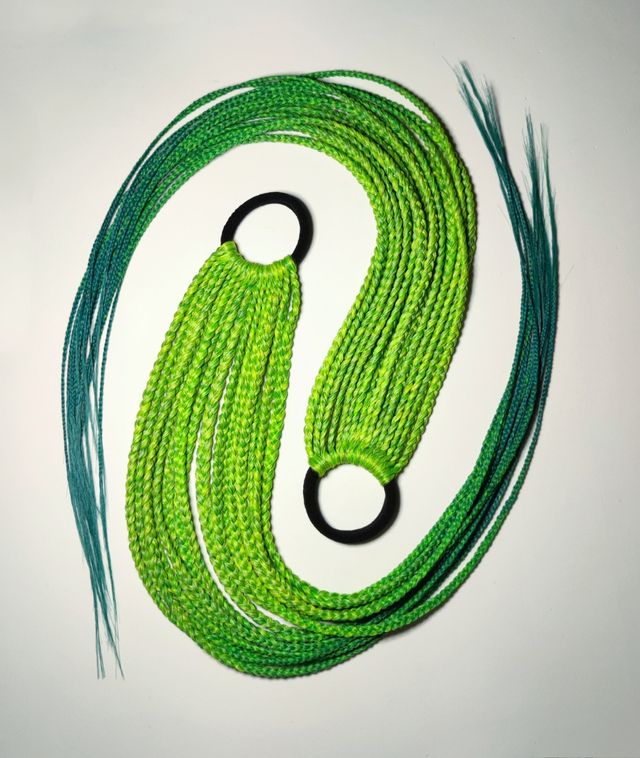 Extensiones de pelo sintético trenzas africanas.