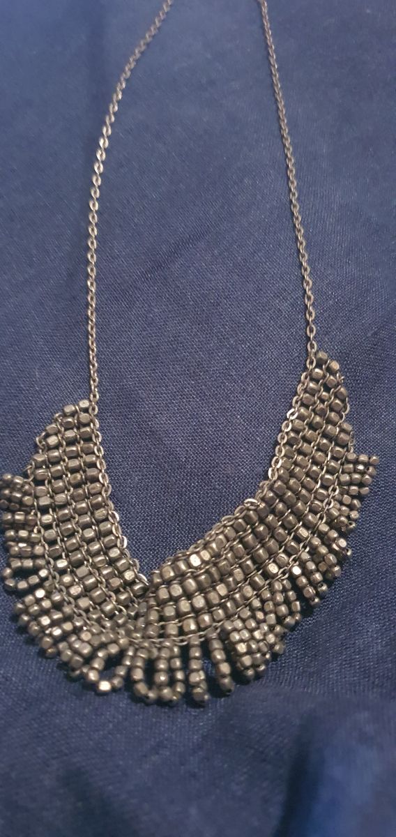 girocollo acciaio antichizzato.