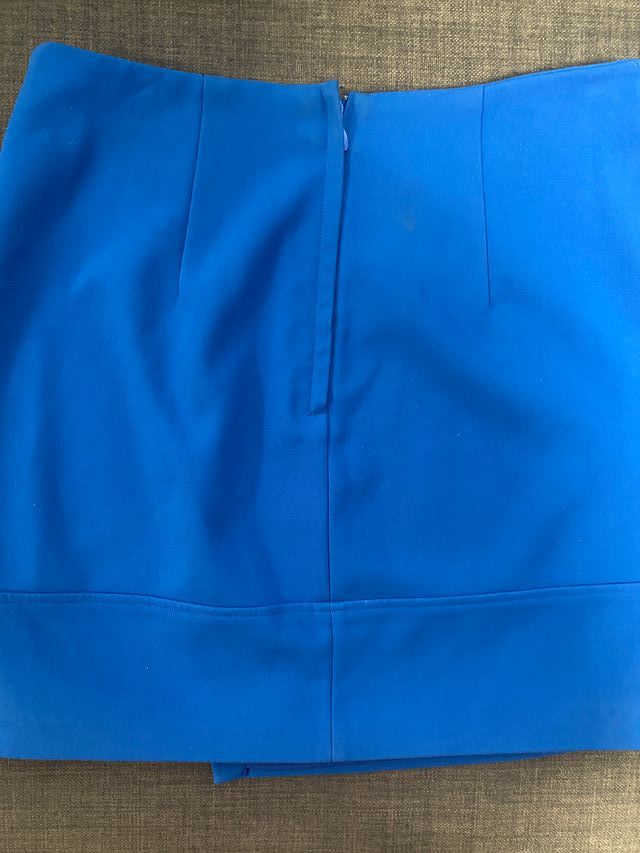 Minifalda ajustada de tela azul H & M talla 38