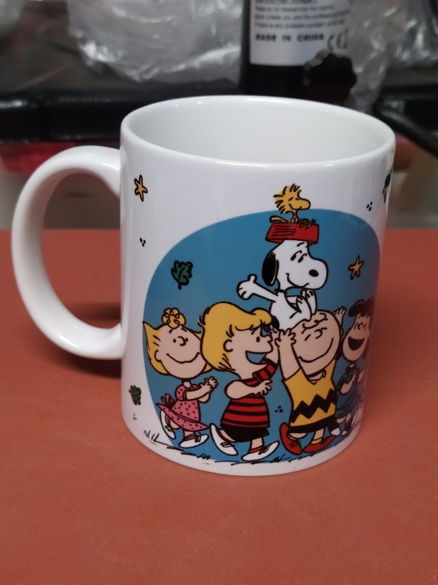 Taza Snoopy "Sonríe y el mundo sonreirá contigo"