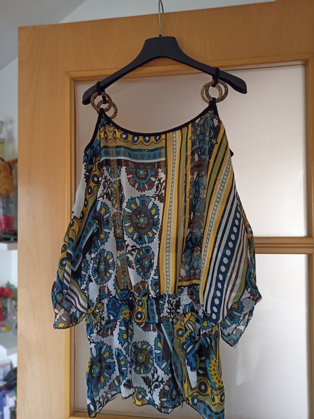 camisola amb els hombros al aire