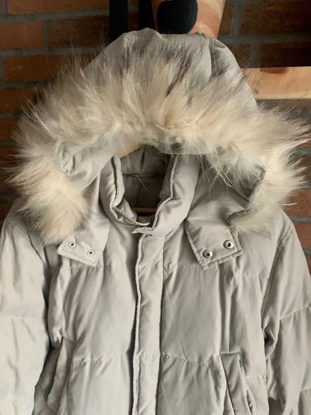 Piumino con pelo e cappuccio