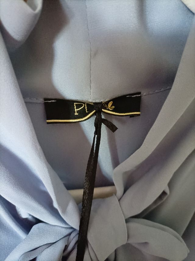 camicetta blusante con fiocco.