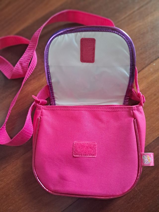 Bolso rosa, caja y peluca de la película Trolls