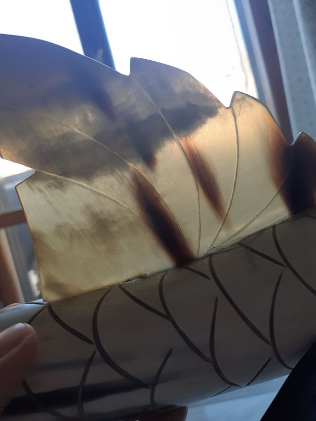 Corno intagliato a forma di pesce