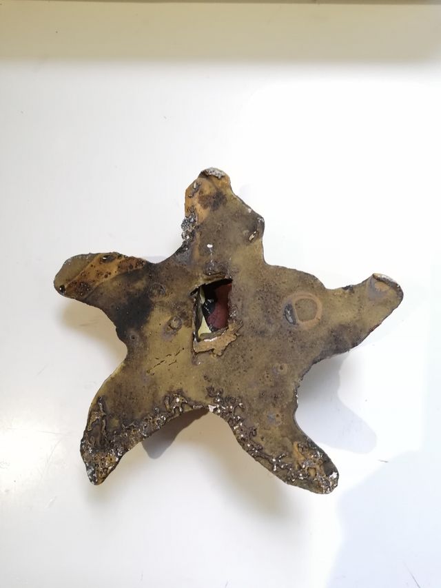 estrella de barro para colgar tipo duende