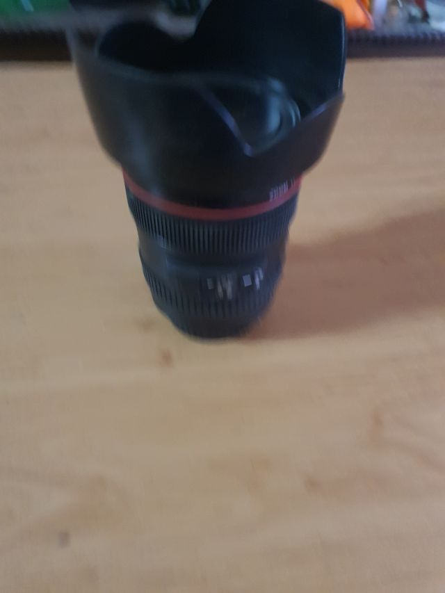 hucha en forma de objetivo de fotos