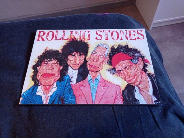 Lamina caricatura de los Rollings Stone