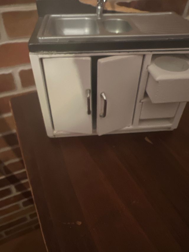 Cocina, lavadora y fregadero