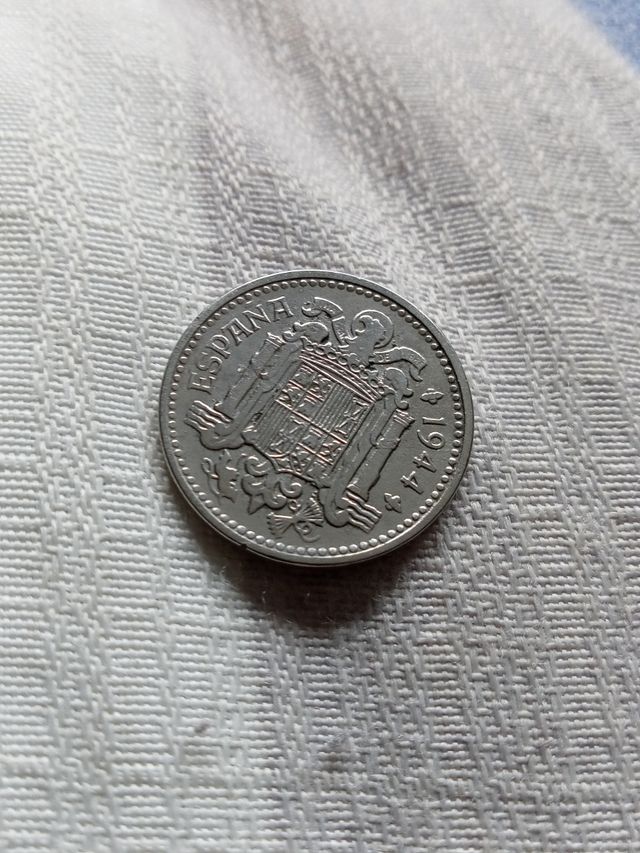 Moneda una peseta tonalidad círculó poco