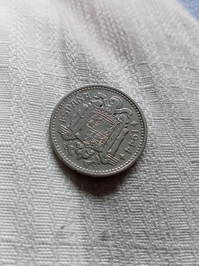 Moneda una peseta tonalidad círculó poco