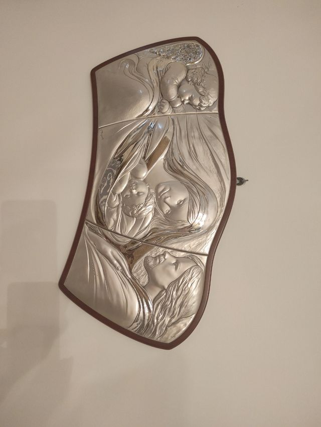 capezzale in argento raffigurante la famiglia