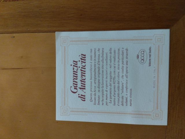 Quadro  in argento e cornice in legno.