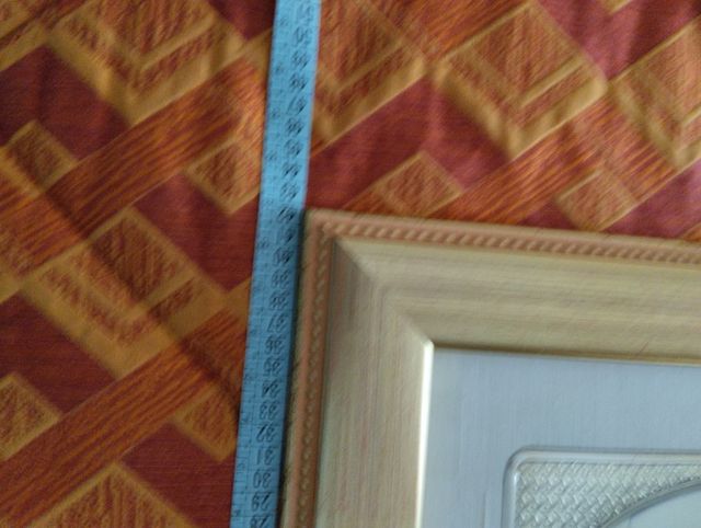 Quadro  in argento e cornice in legno.