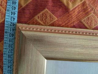 Quadro  in argento e cornice in legno.