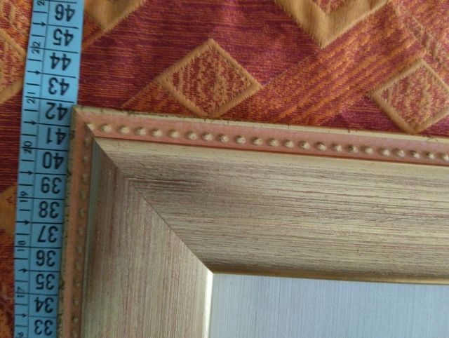 Quadro  in argento e cornice in legno.