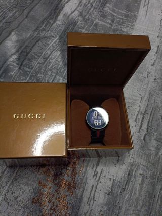 reloj Gucci cuarzo suizo..swiss made 