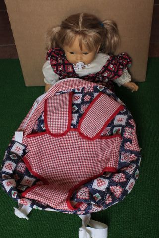 Muñeca bebé con chupete + mochila