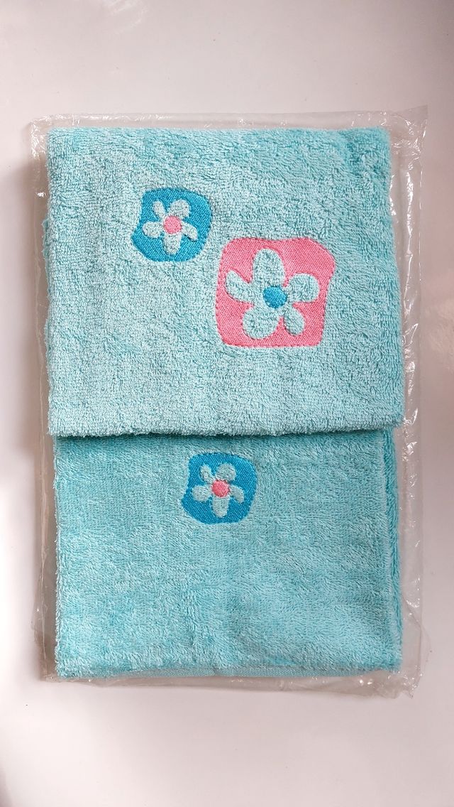 set asciugamano per viso + ospite