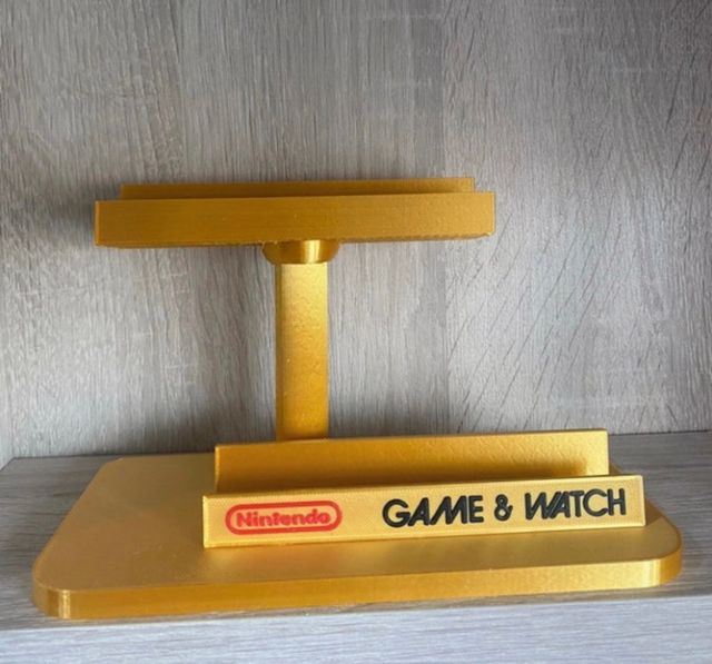 Expositor game & Watch consola y caja .