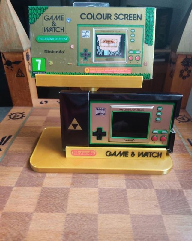 Expositor game & Watch consola y caja .