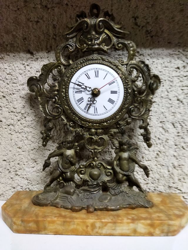 antiguo lo reloj y.candelabros de bronce