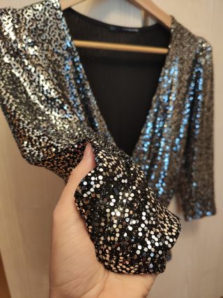 Blusa con brillos de Sfera