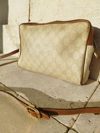 Vintage Gucci bag with strap.