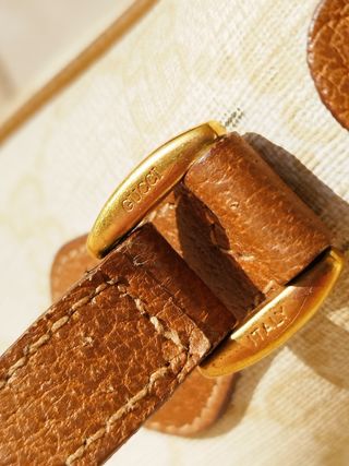 Vintage Gucci bag with strap.