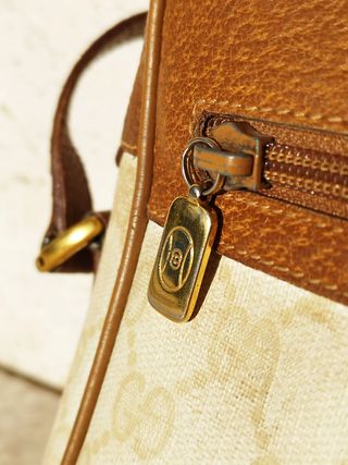 Vintage Gucci bag with strap.