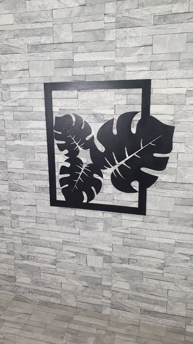 Cuadro hojas tropicales. en madera