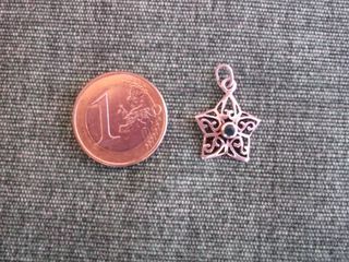Pequeño colgante de plata con forma de estrella