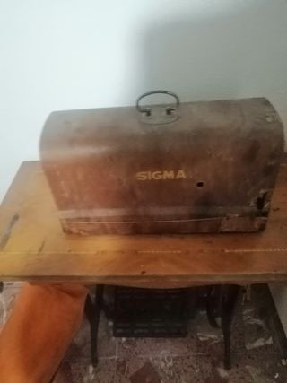 máquina de coser antigua con pie