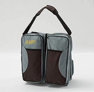 Bolso cambiador y cuna bebé
