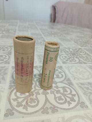 monedas de 25 pesetas, y 1 peseta 