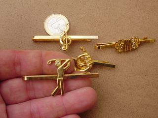 Lote de 4  sujetacorbatas dorados